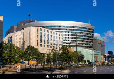 Warsaw, Poland - May 22, 2020: Srodmiescie business district with Zlote Tarasy Golden Terraces office and shopping complex and Mercure hotel Stock Photo