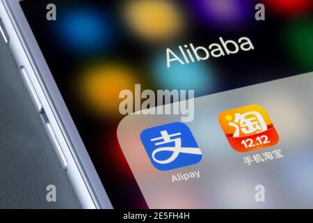 Icons of Alibaba Group's Alipay and Taobao are seen on an iPhone. Alipay is a third-party mobile and online payment platform while Taobao is an e-comm Stock Photo