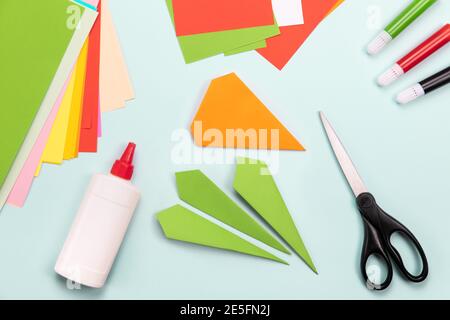 How to make Origami paper bookmark form of carrot for Easter greetings. Children's art project. DIY concept. Step by step photo instruction. Step 5 Stock Photo