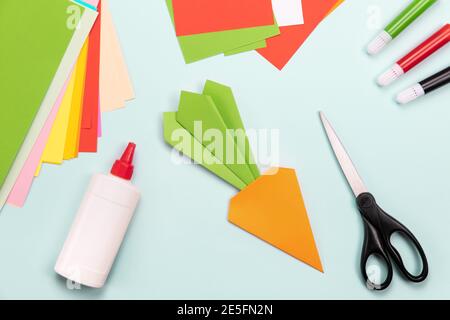 How to make Origami paper bookmark form of carrot for Easter greetings. Children's art project. DIY concept. Step by step photo instruction. Step 6 Stock Photo