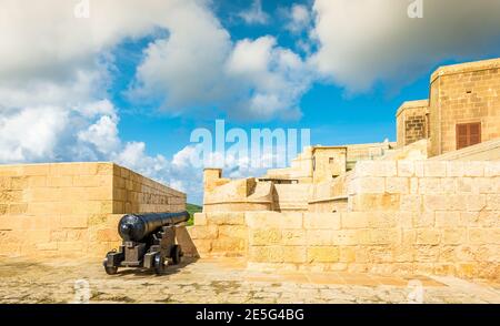 An ancient cannon on the ramparts of the Citadel of Victoria on the island of Gozo in the archipelago of Malta Stock Photo