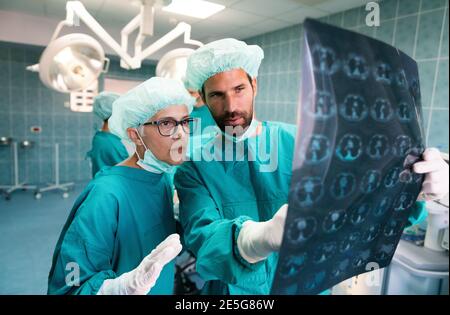 Portrait of intellectual healthcare professionals with at x-ray radiographic image, ct scan, mri Stock Photo