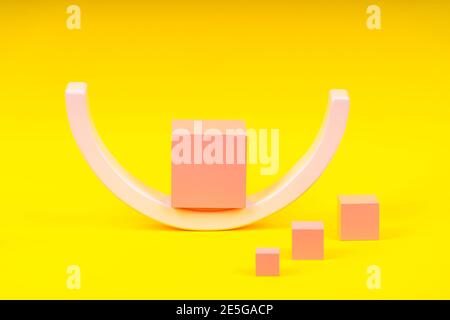 Wooden geometric shapes forms colorful figures composition on yellow background Stock Photo