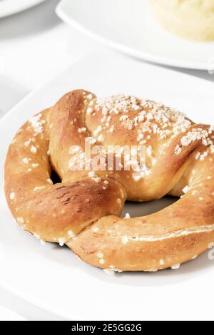 vegan dairy-free organic german traditional pretzel bread on white table Stock Photo
