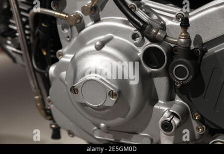 Modern motorcycle engine fragment, close up photo of gray metal parts Stock Photo