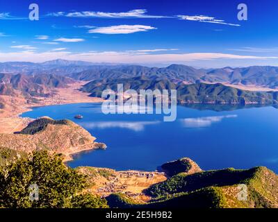 View of Lugu Lake under Blue Sky Stock Photo