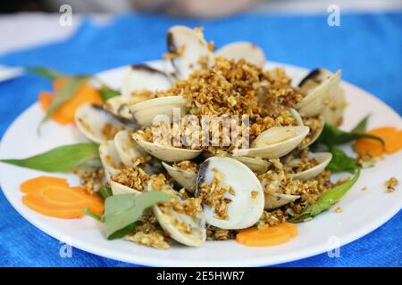 Stir-fried clams with crispy garlic, Vietnamese style Stock Photo