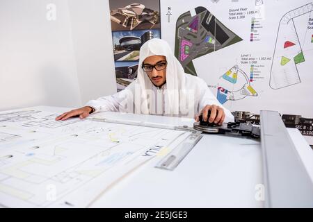 Arab architect preparing his desk to start making his sketch Stock Photo