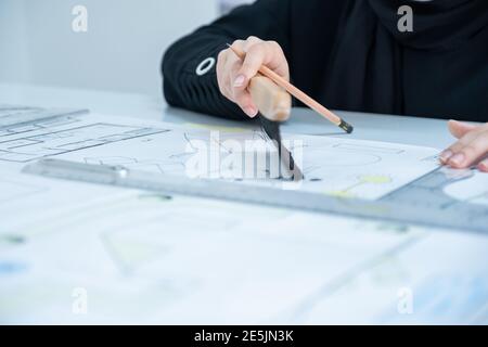 Architect hands with pen and ruler Stock Photo