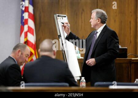Court appointed defense attorney Tim Moore (R) writes a timeline during the capital murder trial of former Marine Eddie Ray Routh at the Erath County Donald R. Jones Justice Center in Stephenville, Texas February 11, 2015. Routh, 27, is charged with murdering Navy SEAL Chris Kyle, who was credited with the most kills of any U.S. sniper, and Kyle's friend Chad Littlefield in 2013. REUTERS/ Tom Fox/Pool (UNITED STATES - Tags: CRIME LAW MILITARY)