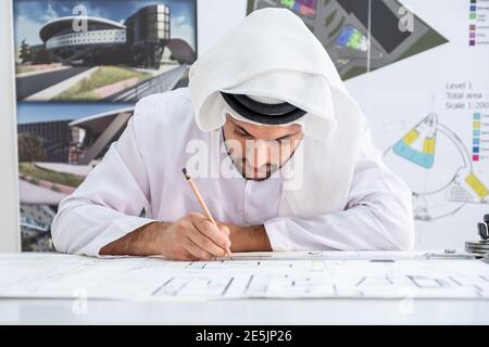 Focused arab architect working on a new project Stock Photo