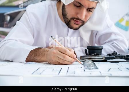 Focused arab architect working on a new project Stock Photo