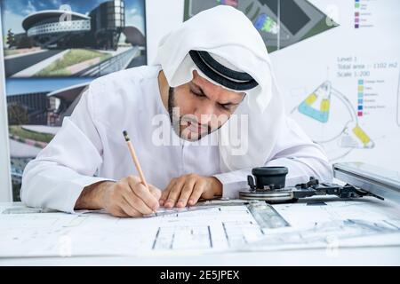 Focused arab architect working on a new project Stock Photo