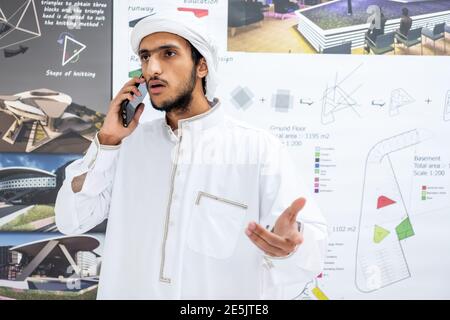 Arab male architect talking and discussing things on the phone Stock Photo