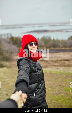 Couple travelers follow holding hands at foggy river landscape, Young family traveling active adventure vacations, woman and man love and travel happy Stock Photo