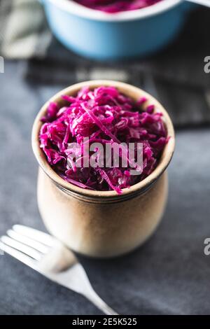 Red sauerkraut. Sour pickled cabbage in a cup. Stock Photo
