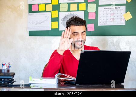 Happy male coach teacher webinar speaker looking at camera giving online class lecture or making conference video chat call, smiling businessman entre Stock Photo