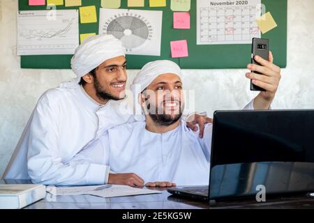 arabian two men in the office taking selfie Stock Photo