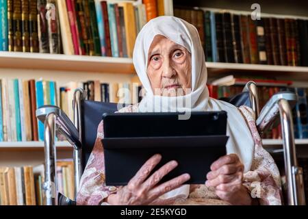 Old woman is using technology Stock Photo