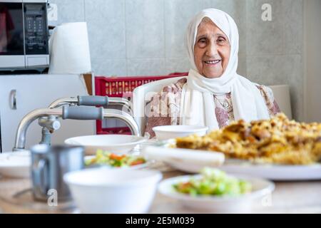 Old woman is using walker Stock Photo