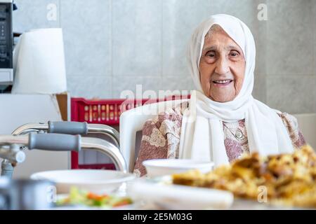 Old woman is using walker Stock Photo