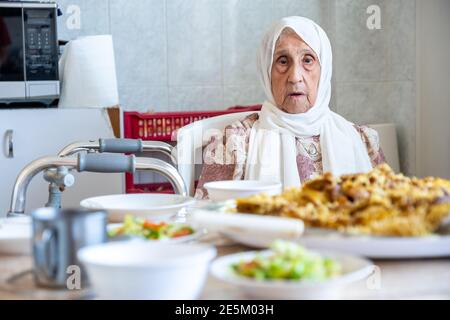 Old woman is using walker Stock Photo
