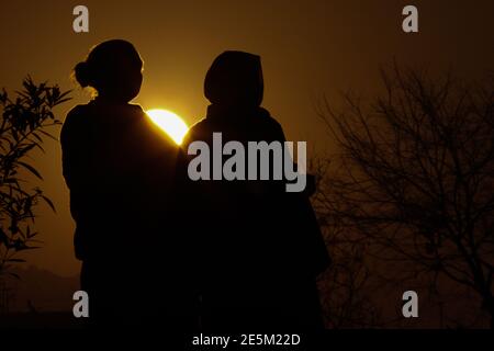 Kathmandu, Kathmandu, Nepal. 28th Jan, 2021. Hindu devotees silhouetted against the rising sun during Madhav Narayan festival at Hanumanghat, Bhaktapur of Nepal, on January 28, 2021. Credit: Aryan Dhimal/ZUMA Wire/Alamy Live News Stock Photo