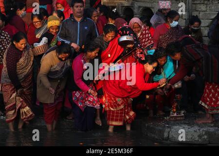 Kathmandu, NE, Nepal. 28th Jan, 2021. Hindu devotees worship the God Madhav Narayan as a month-long festival dedicated to him begins, at Hanumanghat, Bhaktapur of Nepal, on January 28, 2021. Credit: Aryan Dhimal/ZUMA Wire/Alamy Live News Stock Photo