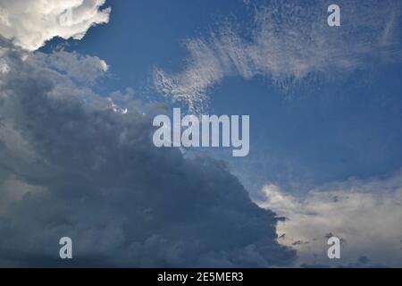 Sky and clouds. Light and dark clouds with striated shapes in blue sky, forming beautiful texture or scene background, photo zoom, Brazil, South Ameri Stock Photo