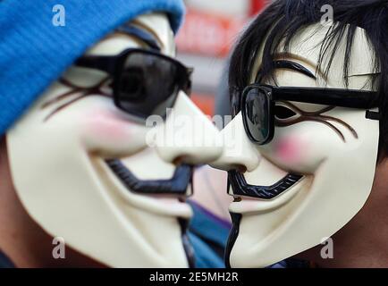 Protesters wearing Guy Fawkes masks, made popular by the graphic novel 'V for Vendetta', take part in a demonstration against ACTA (Anti-Counterfeiting Trade Agreement) in Vienna, February 25, 2012.  Protesters fear that ACTA will curtail freedom of expression, curb their freedom to download movies and music for free and encourage Internet surveillance.   REUTERS/Lisi Niesner (AUSTRIA - Tags: POLITICS CIVIL UNREST TPX IMAGES OF THE DAY)