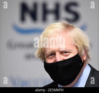 Prime Minister Boris Johnson observes troops setting up a vaccination centre in the Castlemilk district of Glasgow on his one day visit to Scotland. Picture date: Thursday January 28, 2021. Stock Photo