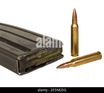 Empty metal assault rifle magazine with two cartridges outside isolated on white Stock Photo