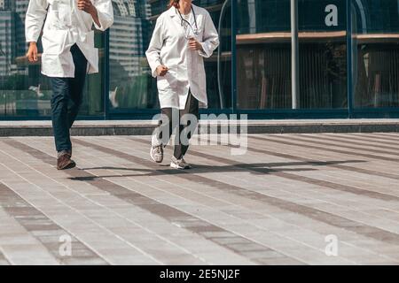 in full growth. medical professionals running to the rescue. Stock Photo