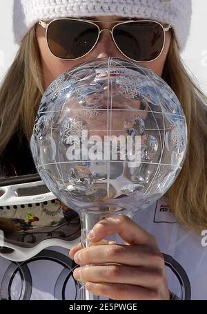 Lindsey Vonn of the U.S. kisses a trophy of the women's Super G discipline at the alpine ski World Cup finals in Schladming March 15, 2012.       REUTERS/Leonhard Foeger (AUSTRIA  - Tags: SPORT SKIING)