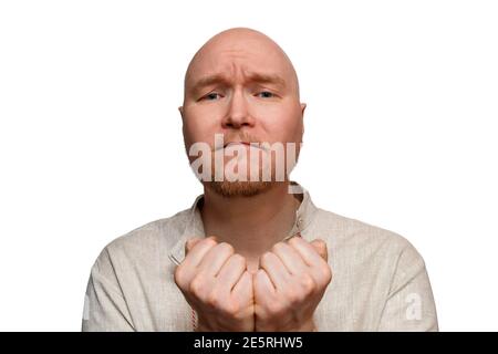 A man in national dress begs for forgiveness Stock Photo