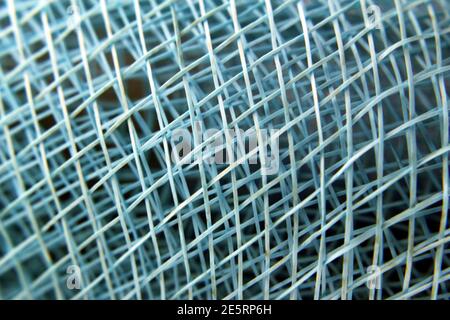 Woven net Detail of blue colored threads Stock Photo