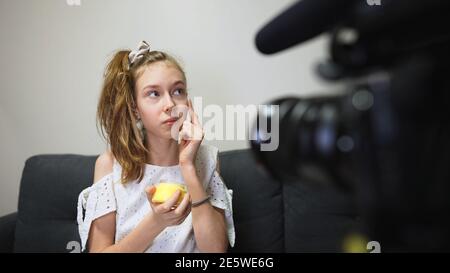 Teenage girl making video blog about skincare. Vlog concept. Stock Photo