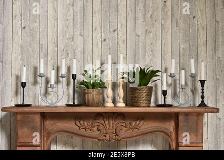 Candles in different candlesticks in the home retro interior Stock Photo