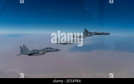 Persian Gulf, Saudi Arabia. 27th Jan, 2021. A U.S. Air Force B-52 Stratofortress strategic bomber from the 2nd Bomb Wing flies escorted by Royal Saudi Arabian Air Force F15-SA fighter aircraft during a short-duration deployment to the middle east January 27, 202 over the Persian Gulf. Credit: Planetpix/Alamy Live News Stock Photo