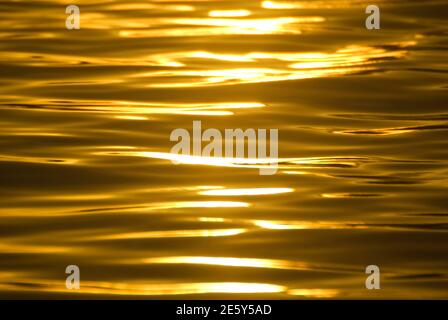 Sunlight reflects on the surface of the ocean Stock Photo