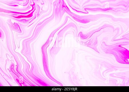 Fluid art texture. Closeup abstract pink, white and grey colors of acrylic for use as background. Liquid acrylic artwork that flows and splashes with Stock Photo
