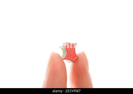 Ecstasy pill in female hand isolated on white backround. MDMA assisted psychedelic therapy. Stock Photo