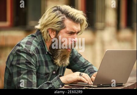 Businessman laptop terrace. Online education. Surfing internet. Modern communication. Risky shopping. Stock trader. Online business. Online entrepreneur working outdoors. Man busy work with laptop. Stock Photo