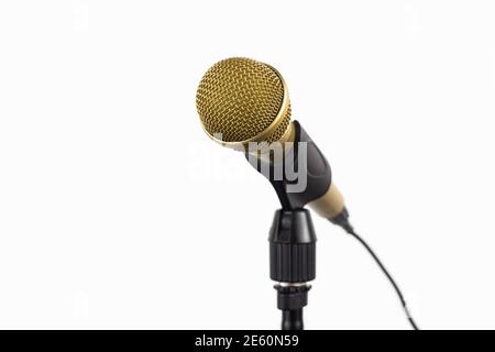 Golden microphone on a stand on white background Stock Photo