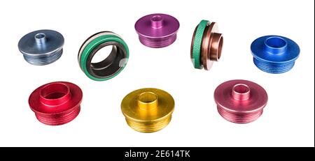Set of aluminum router template guide bushings isolated on white background. Colorful copying rings and green nuts for wood milling. Woodworking tool. Stock Photo