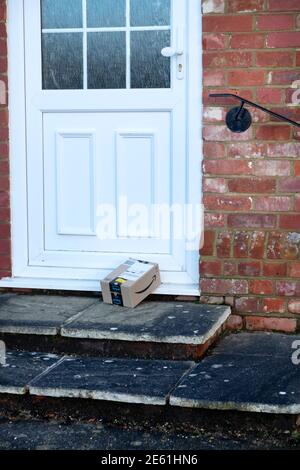 An Amazon Prime package left on a doorstep Stock Photo