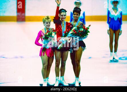 Katarina Witt (GDR) Gold medalist and Olympic Champion (C),Elizabeth Manley (CAN) silver -L- and Debi Thomas (USA) bronze in Ladies Figure Sjkating at the 1988 Olympic Winter Games Stock Photo