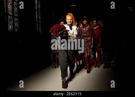 Designer Vivienne Westwood walks on the catwalk with her models after the presentation of her Vivienne Westwood Red Label 2012 Autumn/Winter collection during London Fashion Week February 19, 2012. REUTERS/Suzanne Plunkett (BRITAIN - Tags: FASHION)