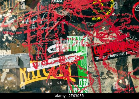 Grunge background with old torn posters Stock Photo