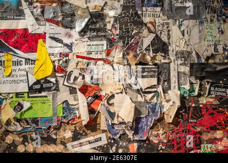 Grunge background with old torn posters Stock Photo